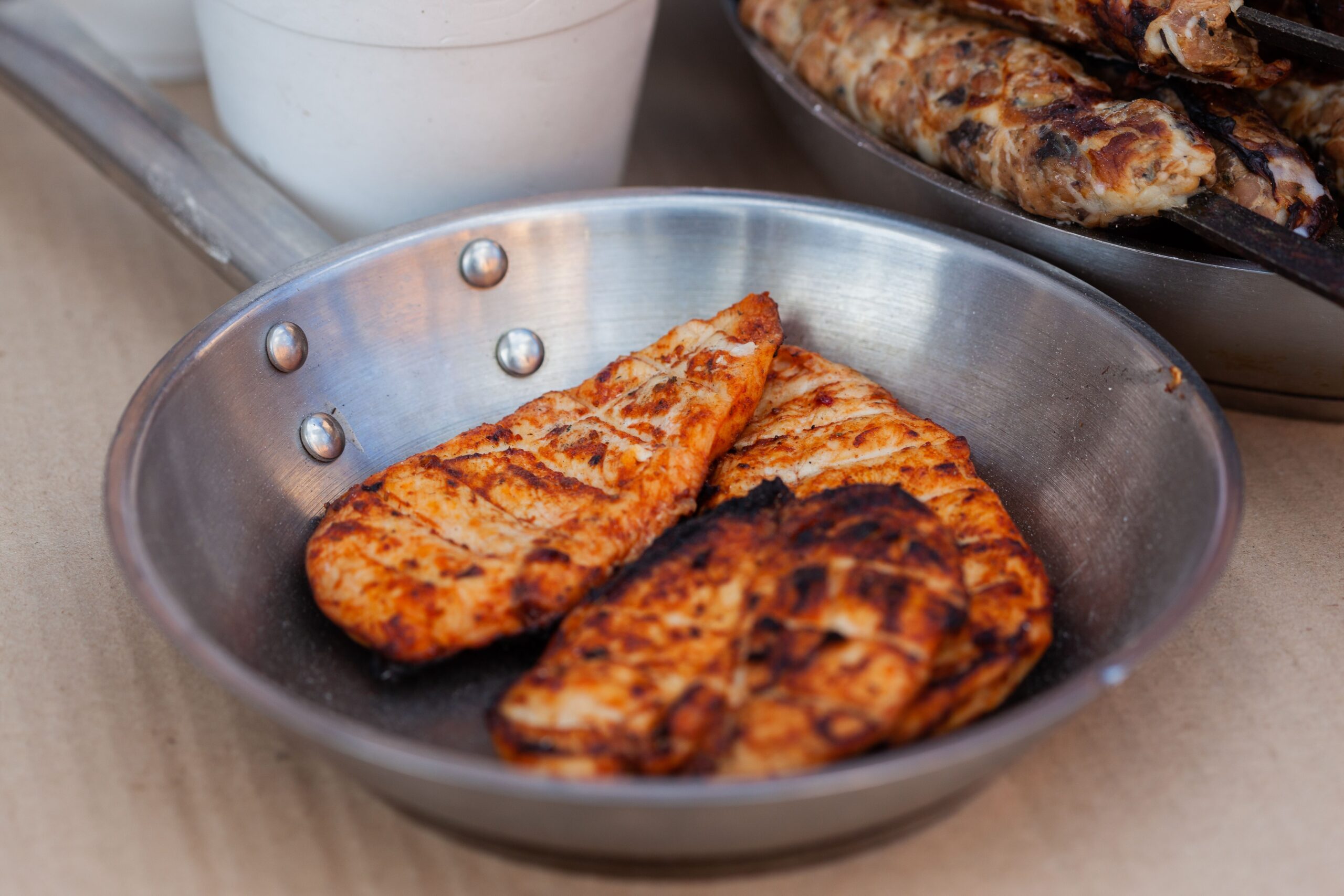 Golden baked chicken breast in a baking pan fresh from the oven