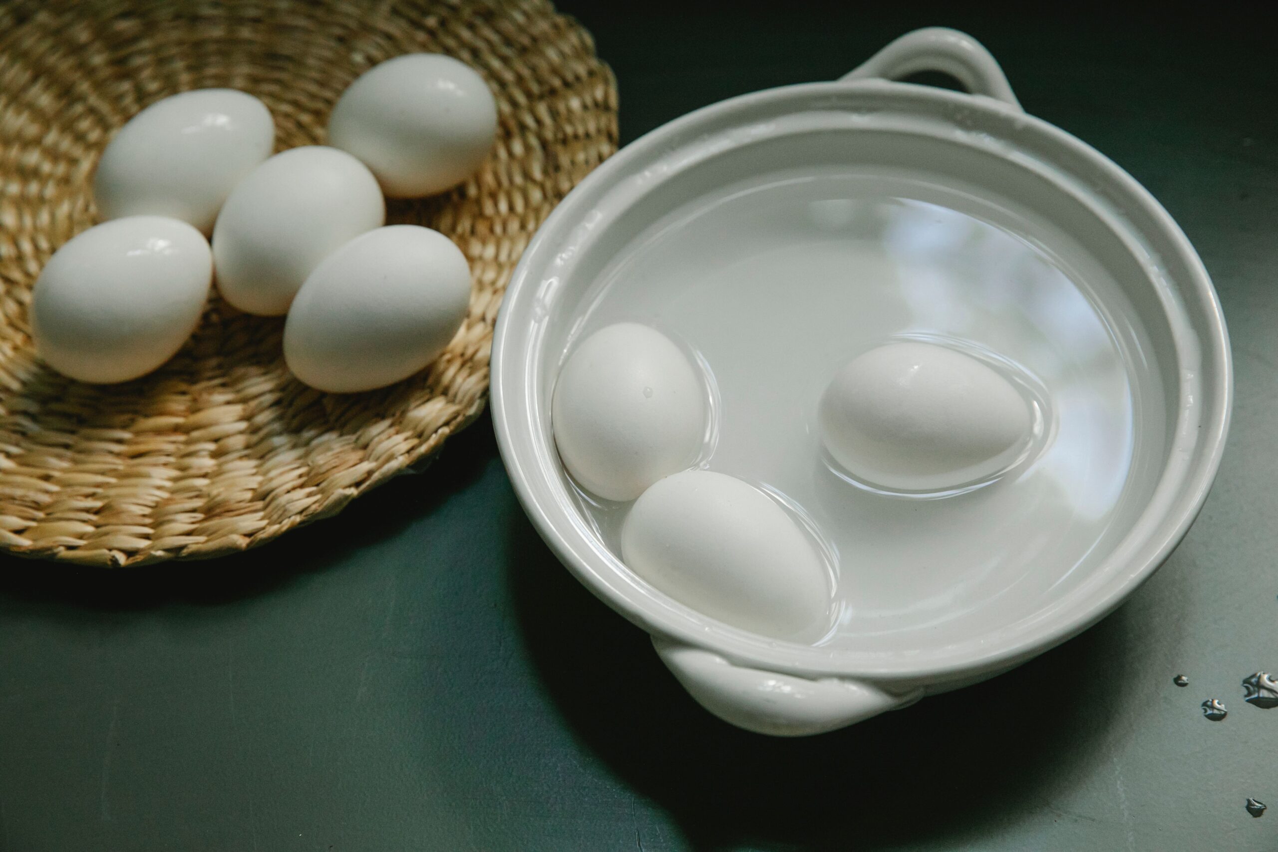 Cooked eggs cooling in an ice water bath immediately after boiling