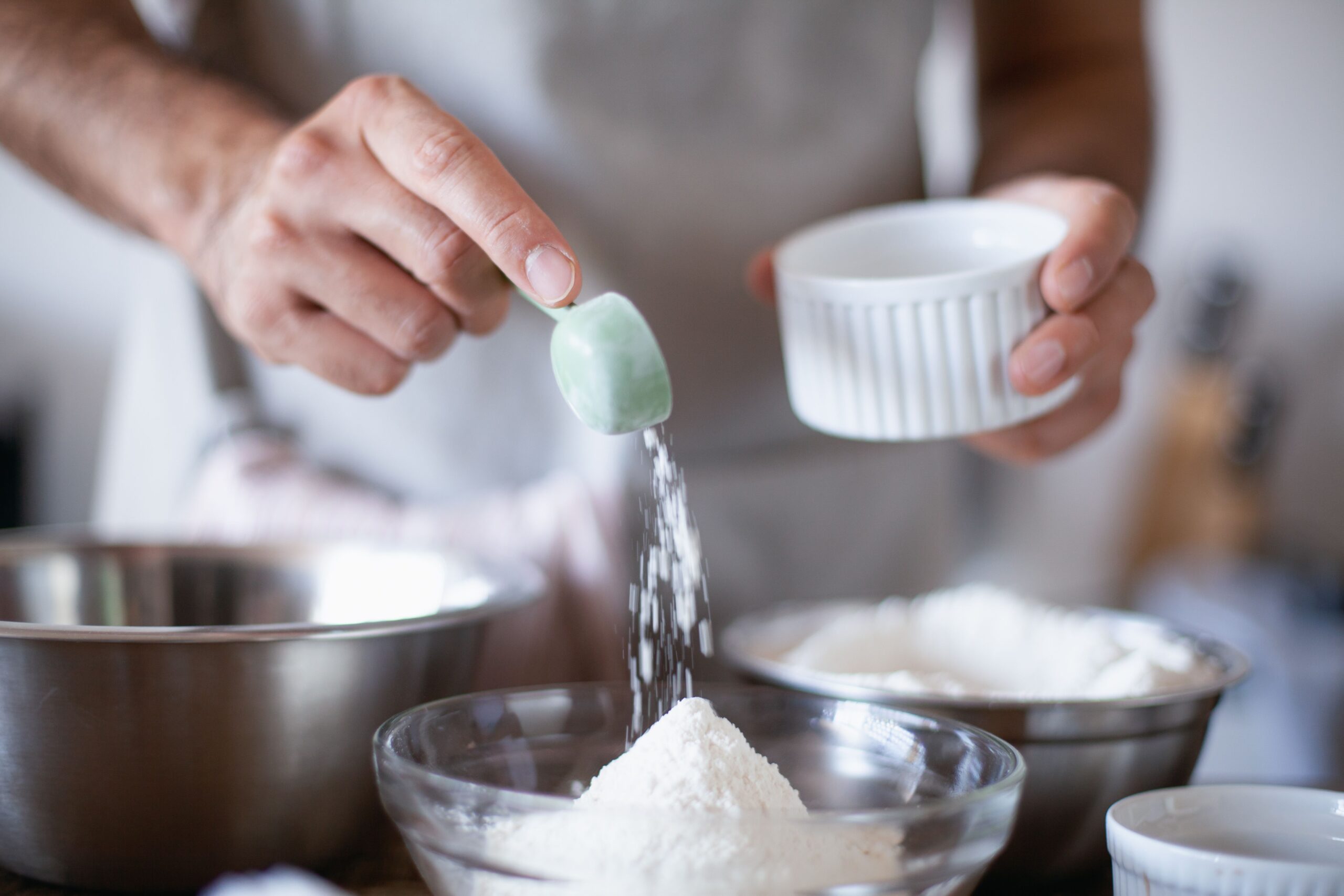 Level measuring tablespoon filled with baking ingredient and scraped flat for accuracy