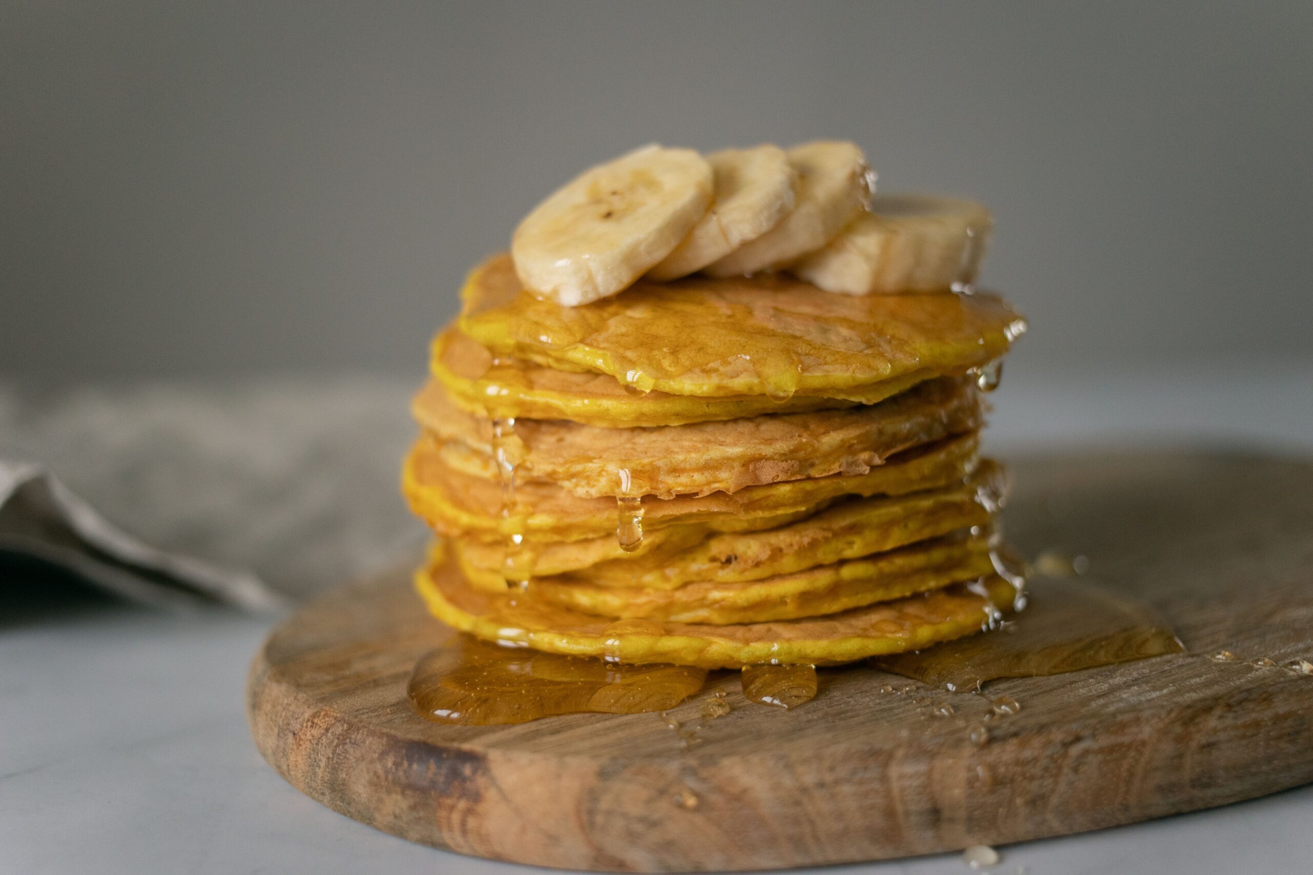 Fluffy dairy-free pancakes on a plate, made with plant-based milk